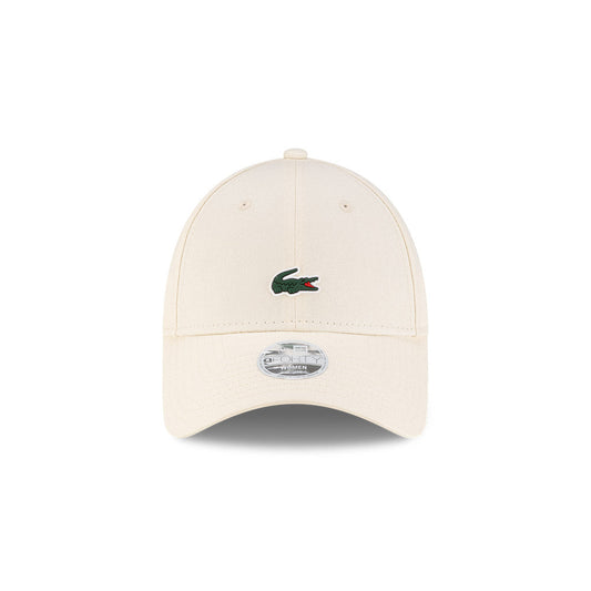Front view of New Era x Lacoste 9FORTY Women Core Light Beige Adjustable Cap highlighting the centered crocodile logo