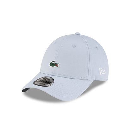 Front left view of New Era x Lacoste 9FORTY Core Light Blue Adjustable Cap highlighting the classic New Era flag logo