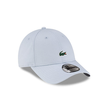 Front right view of New Era x Lacoste 9FORTY Core Light Blue Adjustable Cap displaying the classic crown.