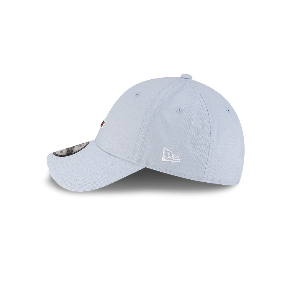 Left side profile view of New Era x Lacoste 9FORTY Core Light Blue Adjustable Cap featuring stitched white flag logo.