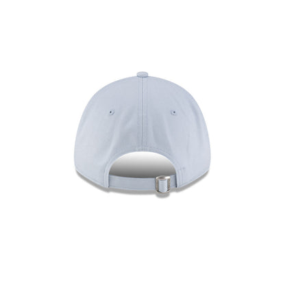 Rear view of New Era x Lacoste 9FORTY Core Light Blue Adjustable Cap showcasing cloth strapback and metal closure.
