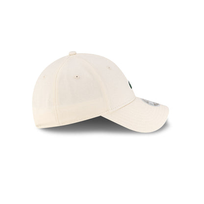Right side profile view of New Era x Lacoste 9FORTY Women Core Light Beige Adjustable Cap showing pre-curved visor.