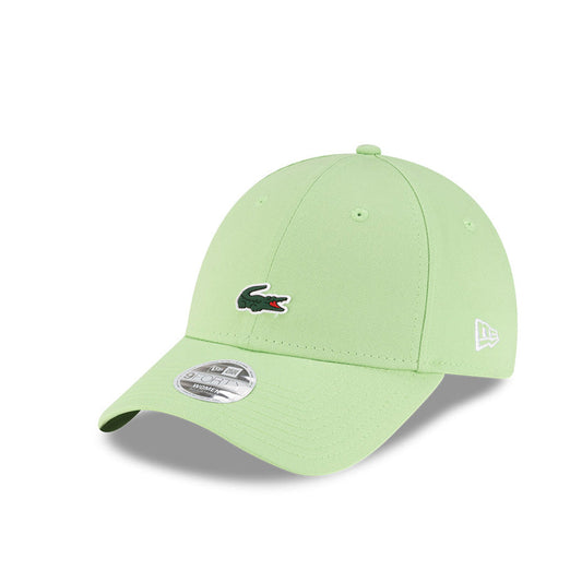 Front left view of New Era x Lacoste 9FORTY Women Core Pastel Green Adjustable Cap highlighting the classic New Era flag logo