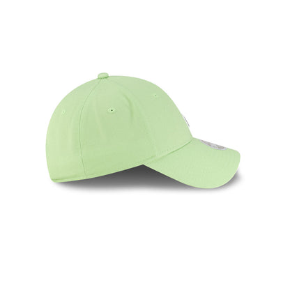 Right side profile view of New Era x Lacoste 9FORTY Women Core Pastel Green Adjustable Cap showing pre-curved visor.