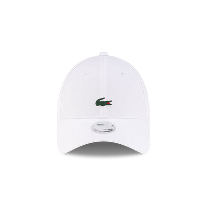 Front view of New Era x Lacoste 9FORTY Women Core White Adjustable Cap highlighting the centered crocodile logo