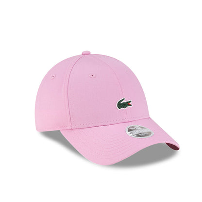 Front right view of New Era x Lacoste 9FORTY Women Core Pastel Pink Adjustable Cap displaying the classic crown.