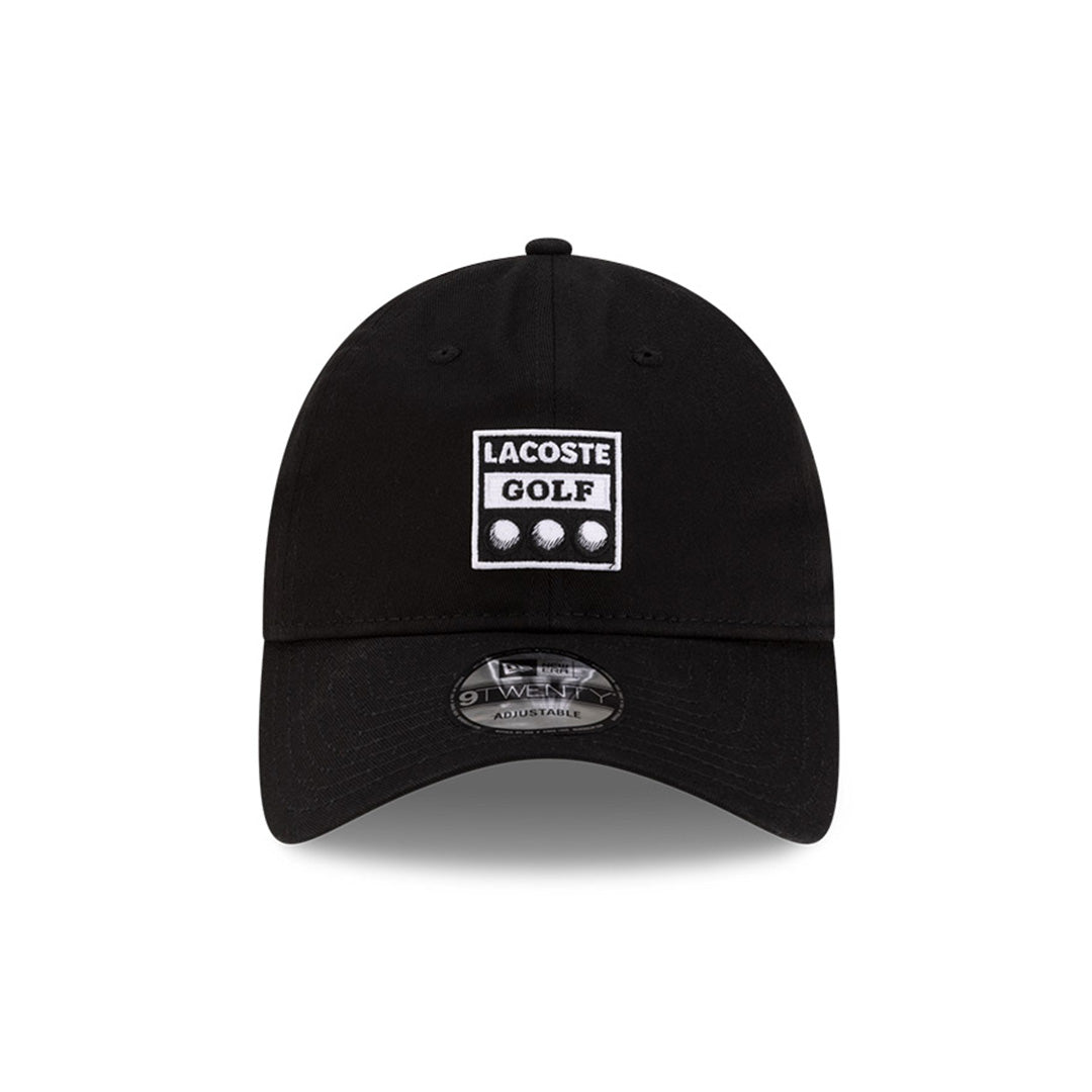 Front view of New Era x Lacoste 9TWENTY Golf Ball Black Adjustable Cap highlighting the rectangular Lacoste Golf patch