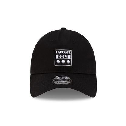 Front view of New Era x Lacoste 9TWENTY Golf Ball Black Adjustable Cap highlighting the rectangular Lacoste Golf patch